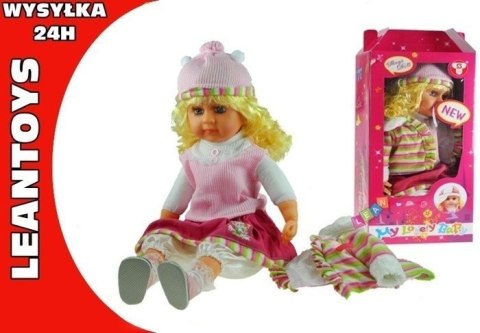 Duża lalka z długimi kręconymi włosami jak żywa